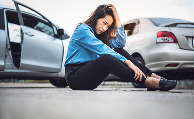 Asian business woman sitting on the floor, she stressed and wait for notify insurance agents From...