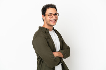 Caucasian handsome man over isolated white background with arms crossed and looking forward