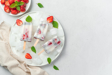 Obraz na płótnie Canvas Ice cream with strawberries and chia seeds on a light background.