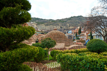 Naklejka premium Popular city landmark in Tbilisi. Ancient underground complex of sulfur baths