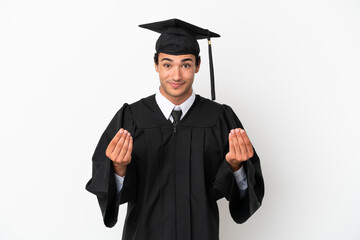 Young university graduate over isolated white background making money gesture