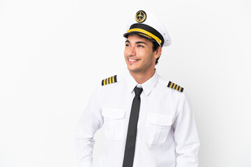 Airplane pilot over isolated white background laughing © luismolinero