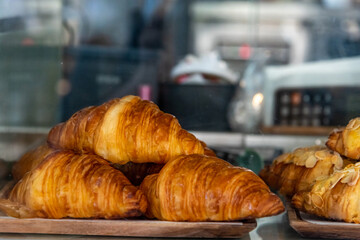 Croissant with close up shot from baking and bakery shop front display.
