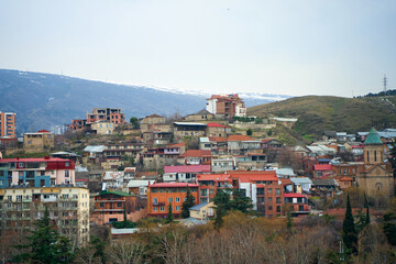 Fototapeta na wymiar City landscape, architecture of Tbilisi. The capital of Georgia. Big city in the highlands