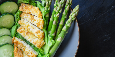 salad bowl chicken meat, asparagus, greens salad leaves vitamin eating organic diet on the table healthy food meal snack copy space food background rustic. top view keto or paleo diet veggie 