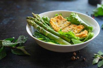 salad bowl chicken meat, asparagus, greens salad leaves vitamin eating organic diet on the table healthy food meal snack copy space food background rustic. top view keto or paleo diet veggie 