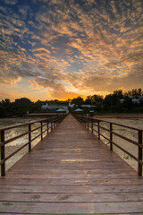Fototapeta na wymiar Beautiful Sunrise on sea with pier for foreground in batam island