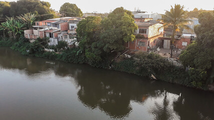Mighty Paraiba do Sul river in Volta Redonda, Rio de Janeiro, Brazil. houses on the banks of the...