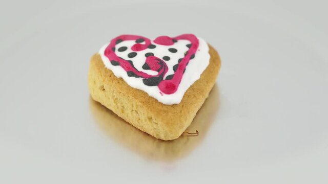 Heart-shaped cookie isolated on white background, decorated cookie for Valentine's day. Love and romatic concept