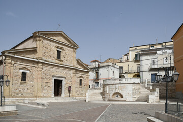 Fototapeta na wymiar Candela, Italy, June 23, 2021. The facade of a church in the historic center of the Apulian town.