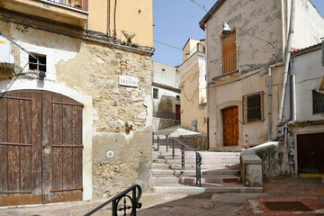 Fototapeta na wymiar A narrow street in Candela, an old town in the Puglia region of Italy.