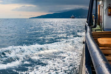 Wave overboard of a moving vessel.