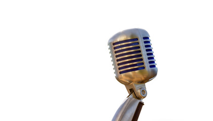 Vintage microphone, metallic retro style with white background and copyspace.