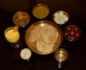 Traditional Jamai Sasthi thali served in brass utensils. Jamai sashthi festival held every year in Bengali families means Long life for Son In law. Jamai 