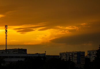 Scenic sunset in a large industrial city after the rain.