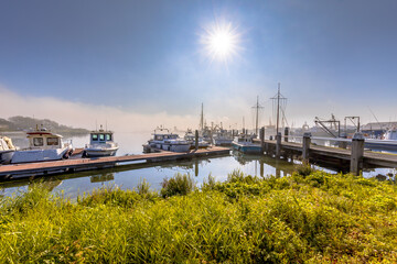 Various ships moored on a wooden quay