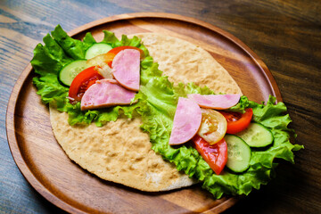pita with vegetables and sausage.simple and delicious snack of flatbread