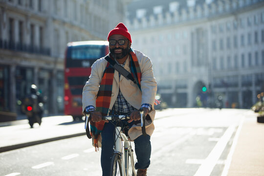 Happy Businessman Riding Bicycle On Sunny City Street, London, UK