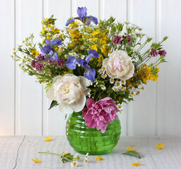 lush garden bouquet. flowers in a glass vase.