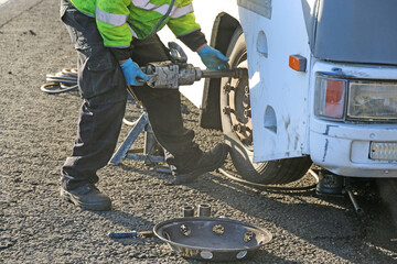 Mechanic repairing a Flat tyre on a motorhome	