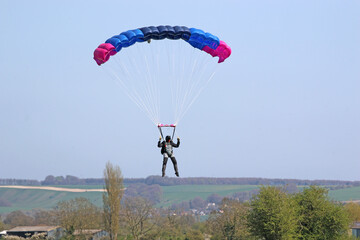 Skydiver landing in a field