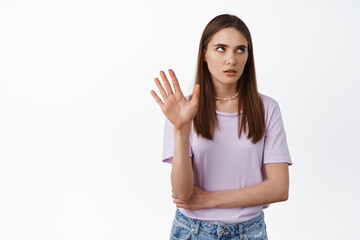 Stop talking. Blah blah so annoying. Young arrogant woman roll her eyes and raising hand to block,...