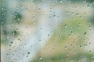 Raindrops on the window pane. Background for the inscription
