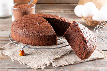 Photo of delicious chocolate sponge cake on table