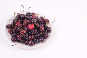 Ripe fresh washed 
cherries isolated on white background with copy space.