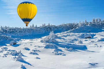 a yellow balloon flies into the sky. winter landscape forest from a height of