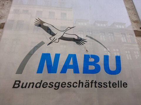 Berlin, Germany - April 5, 2019: Sign of NABU Bundesgesch&auml;ftsstelle. The Naturschutzbund Deutschland e.V. (Nature and Biodiversity Conservation Union), NABU, is a German non-governmental organisation