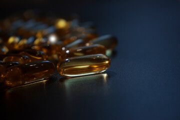 capsules on a dark surface