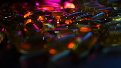 capsules on a dark surface