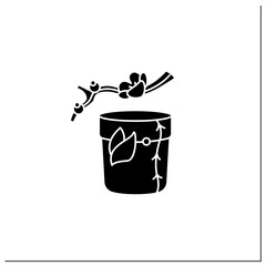 Tea caddy glyph icon. Special box for traditional herbal tea.Japanese ethnic and national ceremony. Sakura twig. Tea ceremony concept.Isolated vector illustration