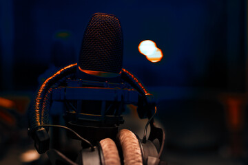 microphone and headphones in recording studio