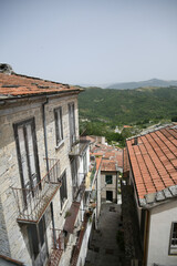 A small street between the old houses of Poggio del Sannio, a medieval village in the Molise region.