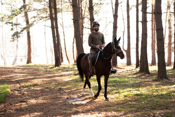 Young Man Wearing Helmet and Riding Horse