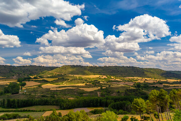 Fototapeta na wymiar Photo landscape of the Spanish Algarve. Castile land. Landscape of Guadalajara. Harvest fields under blue sky with clouds.
