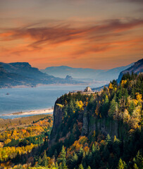A sunrise view of Crown Point and the Vista House and the Columbia River Gorge national Scenic Area...