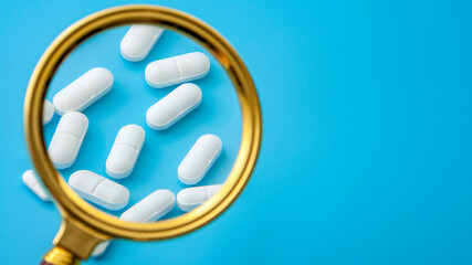 Laboratory investigation and pharmaceutical industry review with scientist using magnifying glass...