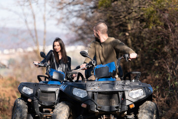 Couple Driving Off-road With Quad Bike or Atv