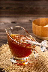 Honey in glass bowl on the table.