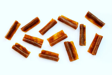 Dried mango paste on white background.