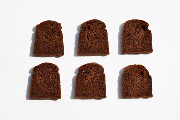 Dark cocoa bread on white background.