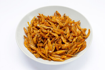 Fried Anchovies in white plate on white background.