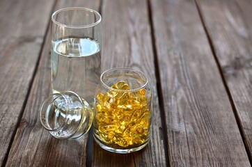 Omega-3 fatty acid. Cod liver oil in the form of yellow gelatin capsules.