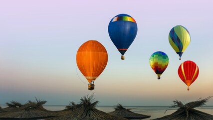balloons fly over the sea into the sky