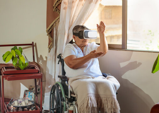 woman in wheelchair with virtual reality glasses