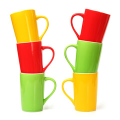 red, yellow and green cups on white background