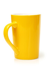 red, yellow and green cups on white background